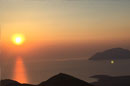 sunset from profitis ilias mountain in milos