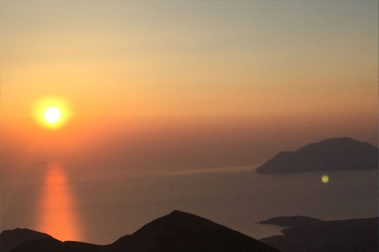 sunset from profitis ilias mountain in Milos Greece